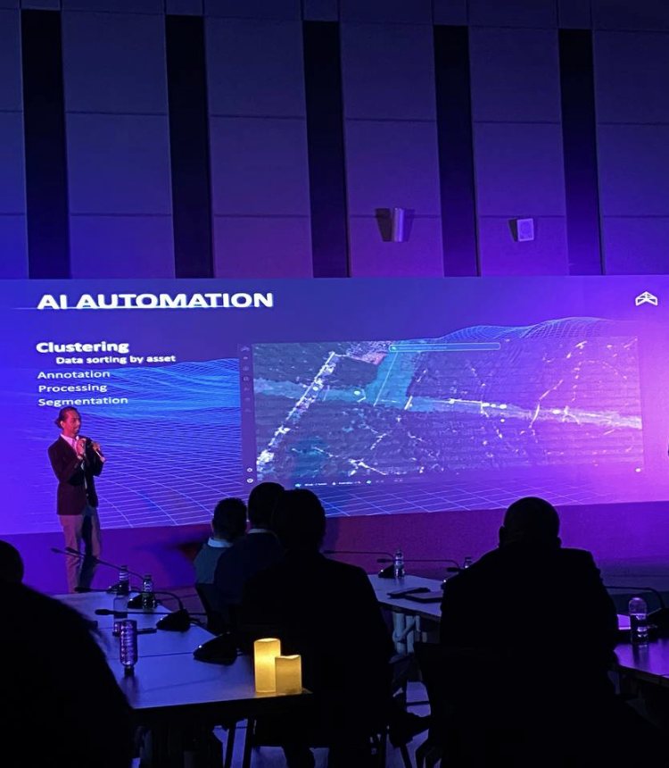 Alif on stage presenting AI automation for drone data: clustering, annotation, processing and segmentation