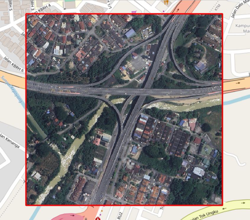 Satellite image of a highway interchange crossing a river