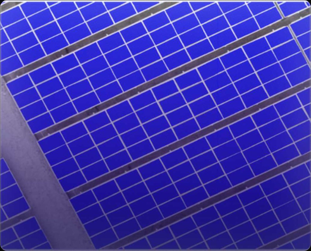 Solar panels seen from a drone, each panel outlined by the segmentation model